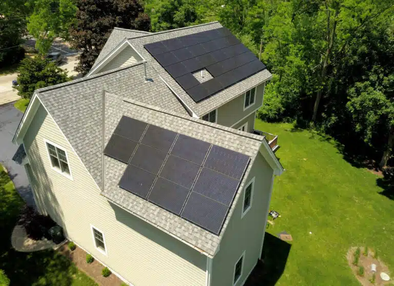solar panel installation on a big house with a backyard
