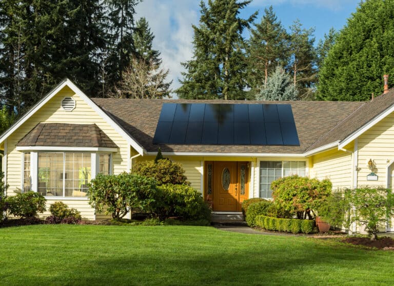 home having solar panels installed with a big porch