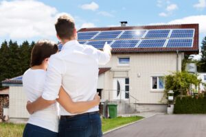 couple looking at their solar panel installment